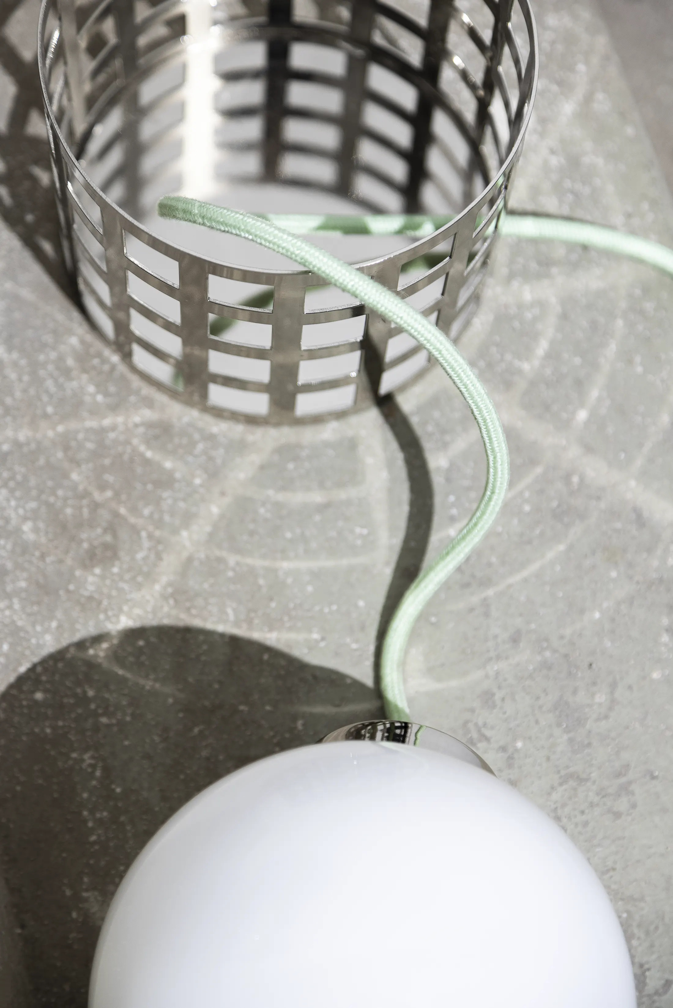 Full Moon Ride Table Lamp - Inspired by the iconic chrome finishes of the Mid Century era. Features a meticulously crafted grid pattern accentuating its geometric harmony. Conceptually alluring and transcending boundaries of conventional lighting.